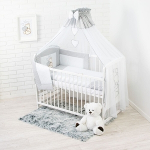 Widok całego zestawu 10 elementów pościeli w odcieniach szarości.